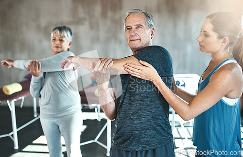 Image of Stretching, physiotherapy and old man with personal trainer for fitness, wellness or rehabilitation. Health, workout or retirement with senior patient and physiotherapist in gym for warm up training