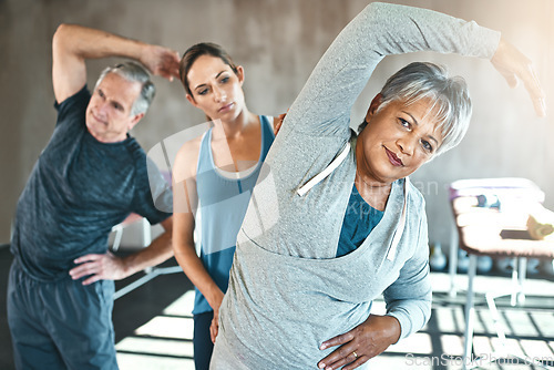Image of Stretching, physical therapy and old woman with personal trainer in class for fitness, wellness or rehabilitation. Health, workout or retirement with senior patient and physiotherapist for warm up