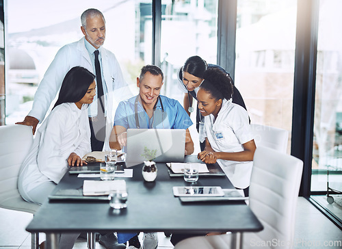 Image of Doctor, diversity and laptop in team meeting for healthcare strategy, planning and collaboration in a hospital. Group of doctors, teamwork and discussion on computer technology with medical students