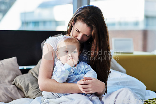 Image of Mother, baby and sad with depression at family home due to mental health and is frustrated. Child, mom and postpartum with worry and anxiety at home with insomnia has love for children development.