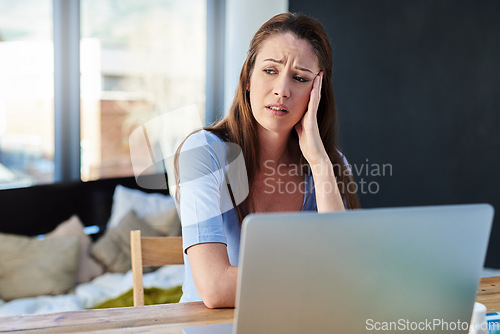 Image of Headache, home office and woman with stress working on a freelance project with a laptop. Burnout, remote work and female freelancer with migraine in pain doing research at desk or workspace at house