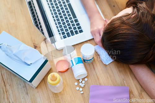 Image of Top view, sick and woman with a laptop, sleeping and burnout with medicine, tired and career. Female person, professional or employee with medication, healthcare issue or problem with pills or tissue