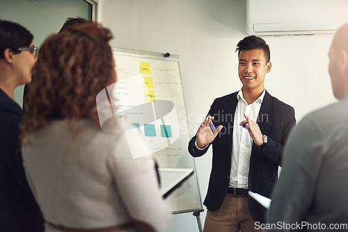 Image of Presentation, businessman with a chart and planning in a modern workplace office together with a lens flare. Teamwork or collaboration, data review or ideas and diverse coworkers in a workshop