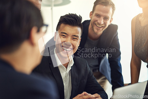 Image of Business meeting, happy people and manager with group for job review, feedback and discussion or teamwork. Corporate, professional or man talking to employees for news, advice and planning on laptop