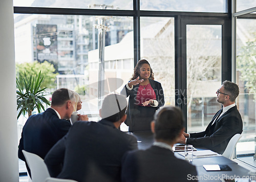 Image of Presentation, leadership with woman and colleagues in a business meeting in a boardroom of their workplace together. Planning or brainstorming, teamwork or collaboration and coworkers in office