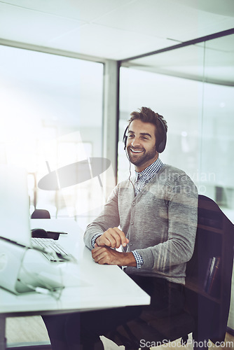 Image of Man, call center and happy talking in office or consultant in conversation with a client, customer support or employee on computer. Contact us, businessman or communication for help, crm or service