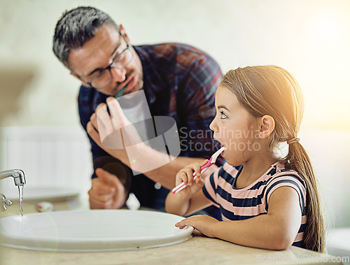 Image of Child, father and brushing teeth in bathroom, bonding and cleaning together. Dad, girl and toothbrush for dental hygiene, oral wellness or healthy tooth for family care, teaching and learning in home