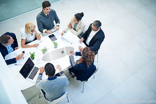 Image of Top view, group and staff in a meeting, finance and planning for budget, investment and schedule. Business people, men or women share ideas, trading and stock market feedback, report and conversation