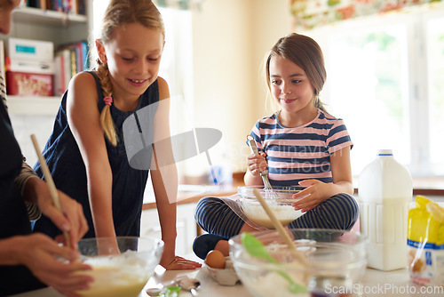 Image of Mother, teamwork or happy kids baking in kitchen as a family with siblings learning cookies recipe at home. Girl, baker or mom helping or teaching children to bake in stove for child development