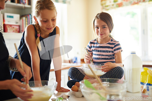 Image of Parent, portrait or happy kids baking in kitchen as a family with siblings learning cookies recipe at home. Girl, cooking or baker helping or teaching children to bake together for child development