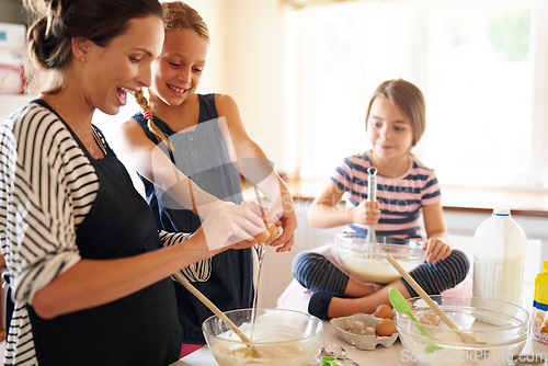 Image of Mother, happy family or kids baking in kitchen with siblings learning cookies recipe or mixing pastry at home. Mom, cooking or baker helping or teaching children to bake together for development