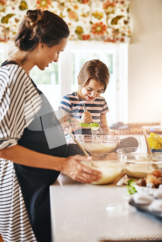 Image of Mother, pregnant or girl baking in kitchen as a happy family with a kid learning cookies or cake recipe at home. Maternity, cooking or mother baker helping or teaching child to bake for development