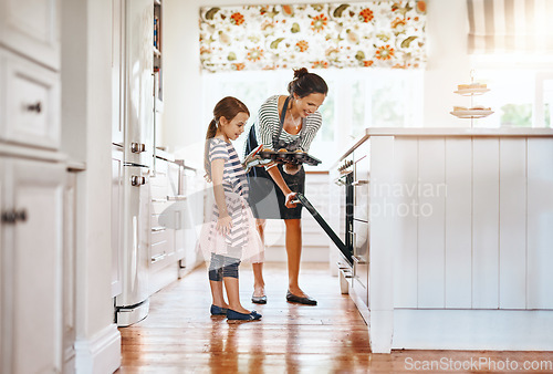 Image of Food, mother with a girl baking and in the kitchen of their home together with a lens flare. Happy family or bonding time, bake or cook and woman with her daughter prepare meal for lunch at oven