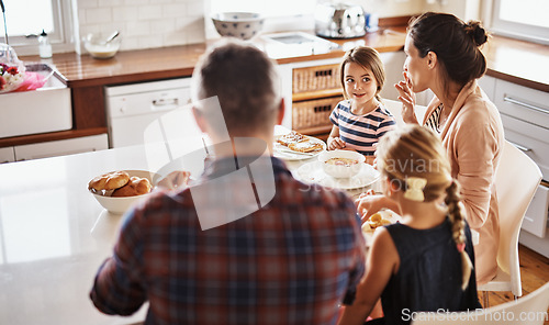 Image of Happy family, morning and breakfast on kitchen table for meal, eating or bonding time together at home. Mother, father and children with healthy food to start the day for nutrition or cereal in house