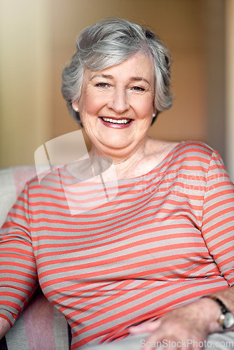 Image of Home, happy and portrait of a senior woman with a smile for retirement and old people happiness. Relax, lounge and an elderly lady in a chair in the living room with confidence and comfort in morning