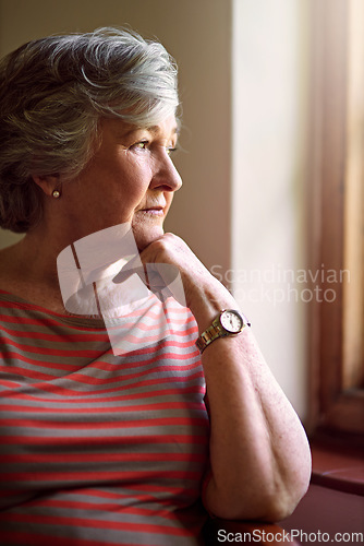 Image of Senior woman, worried and think at window for memory, idea or home on living room sofa. Elderly lady, remember and thinking for decision, depression or retirement with fear, anxiety and lounge chair