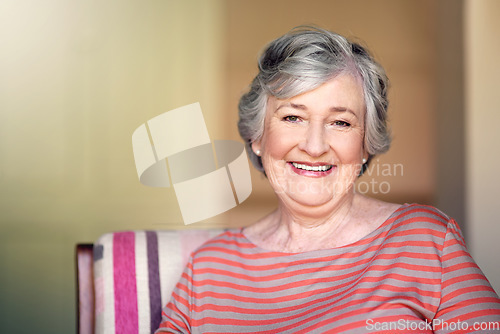 Image of Home, relax and portrait of a senior woman with a smile for retirement and old people happiness. Happy, relaxing and an elderly lady in a chair in the living room with confidence and comfort