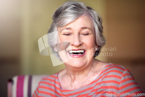 Image of Happy, senior woman and eyes closed in nursing home, living room or laughing in house or relax in retirement. Elderly lady, happiness and smile or laugh at funny, joke with freedom of retired person