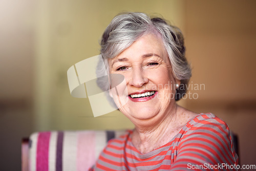 Image of Portrait, nursing home and happy senior woman in living room, laughing in house or relax in retirement. Elderly lady, happiness and healthy person laughing at funny, joke or freedom of retired life