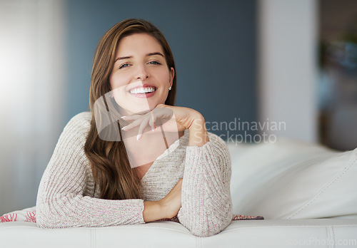 Image of Portrait, happy and woman relax on couch in home living room on holiday. Face, smile or young female person from Canada on sofa in lounge, apartment or house to enjoy me time, vacation or break alone