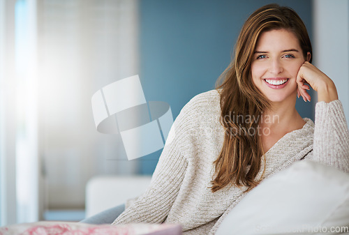 Image of Portrait, smile and woman relax on sofa in home living room on holiday. Face, happy or young female person from Canada on couch in lounge, apartment or house to enjoy me time, vacation or break alone