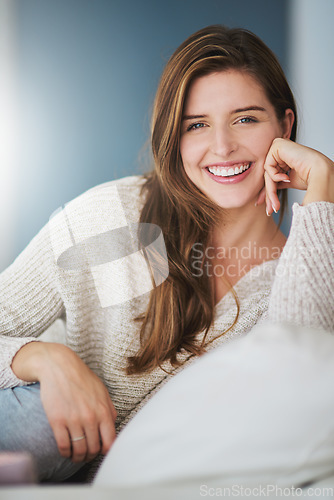 Image of Portrait, smile and woman relax on sofa in home living room on holiday. Face, happy or young female person from Canada on couch in lounge, apartment or house to enjoy me time, vacation or break alone
