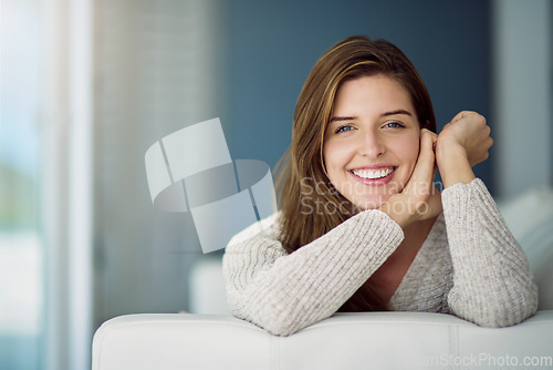 Image of Portrait, happy and woman relax on sofa in home living room on holiday. Face, smile or young female person from Canada on couch in lounge, apartment or house to enjoy me time, vacation or break alone