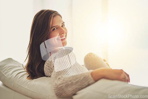 Image of Portrait, smile and woman relax on sofa in home living room on holiday. Face, happy and young female person from Canada on couch in lounge, apartment or house to enjoy me time, vacation and mockup.