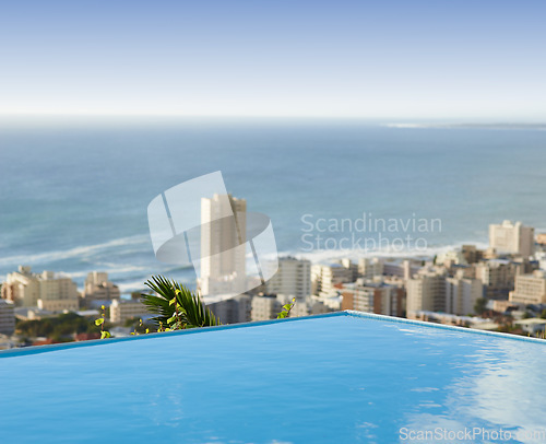 Image of Travel, vacation and pool in city with ocean and hotel view in Cape Town with nobody, buildings and urban beach property. Cityscape, sea and blue sky at luxury accommodation for summer holiday trip.