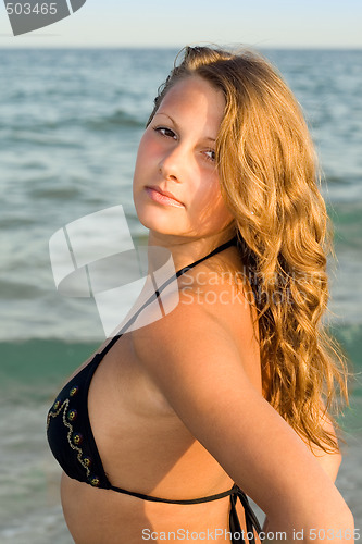 Image of Portrait of the young woman against the sea