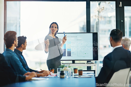 Image of Pregnant, business woman and presentation at a teamwork workshop with speech and communication. Manager, female speaker and company learning with staff and boss with sales graph strategy in office