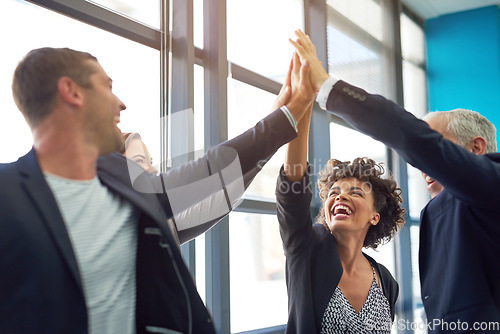 Image of Business people, group high five and celebration in office with team, smile and support for company goals. Men, women and hands in air for teamwork, achievement and motivation at insurance agency