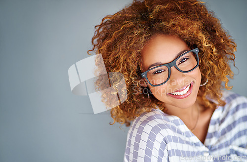 Image of Optometry, happy and portrait of a woman with glasses for eye care in studio with mockup space. Happiness, smile and female model with prescription spectacles isolated by gray background with mock up
