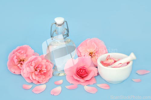 Image of Rose Flower Perfume Preparation with Pink Flowers 