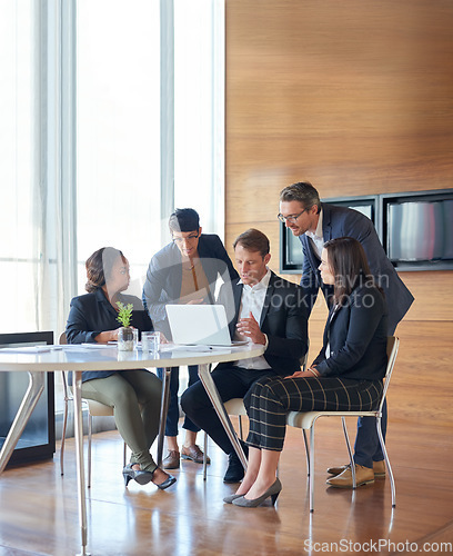 Image of Meeting, collaboration and business people in discussion with a laptop for corporate planning. Teamwork, technology and group of professional employees working on a project together in the workplace.