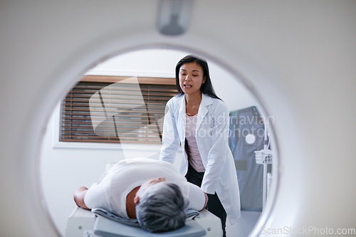 Image of Doctor, mri and woman with patient in hospital ready to start scanner machine. Ct scan, examination and medical professional with senior person before cancer radiology test for healthcare in clinic.