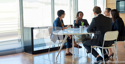 Image of Corporate, talking and business people in a meeting for planning, discussion and legal communication. Teamwork, collaboration and lawyers in a workshop or speaking about a law project together