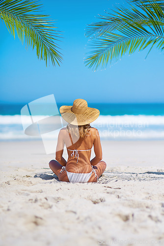 Image of Tropical, holiday and back of woman on beach sand for adventure, summer and vacation in Mauritius. Travel mockup, ocean and female person relax in bikini by ocean for tourism, traveling and getaway