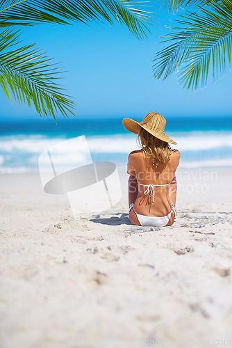 Image of Tropical, island and back of woman on beach sand for adventure, holiday and vacation in Mauritius. Travel mockup, ocean and female person relax in bikini for paradise, tourism and summer getaway