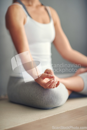 Image of Woman, hands and yoga meditation on mat in spiritual wellness, zen or healthy workout at home. Hand of female person or yogi meditating in mindful exercise, mental health or awareness for fitness