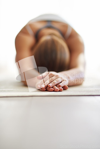 Image of Woman, hands and stretching body in yoga on floor mat for spiritual wellness, exercise or zen workout at home. Female person or yogi in warm up stretch for fitness or mental health on mockup space