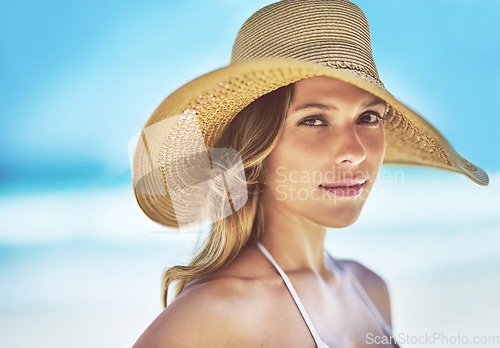 Image of Holiday, summer and portrait of woman at beach for vacation, tropical and relax mockup. Wellness, nature and travel with face of female tourist and hat at seaside for sunbathing and paradise