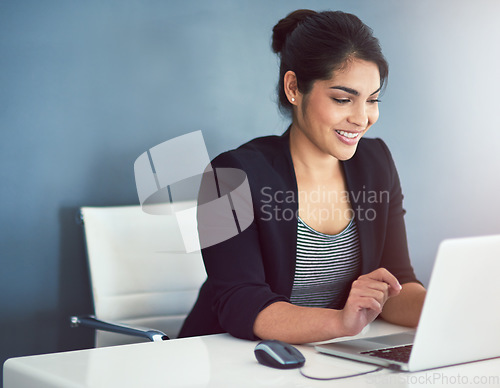 Image of Technology, businesswoman with laptop and at her desk of a modern workplace office. Social networking or online communication, connectivity and female person typing an email at her workstation