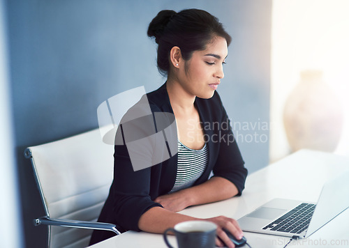 Image of Social networking, businesswoman with laptop and at her desk in a modern workplace office with a lens flare. Online communication or technology, connectivity and female person at her workspace