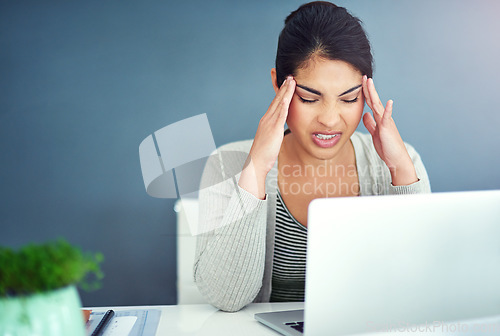 Image of Business woman, stress headache and laptop in office with hands, mistake and anxiety at desk at startup. Young businesswoman, burnout and pain with fatigue, frustrated and glitch on pc in workplace