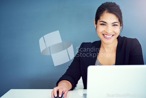 Image of Success, smile and portrait of businesswoman working on a laptop by wall with mockup space. Happiness, confidence and professional female human resources manager doing research in office with mock up