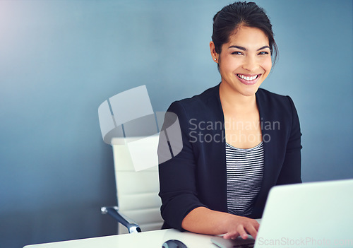 Image of Confidence, portrait and businesswoman working in the office on laptop by wall with mockup space. Happy, smile and professional female human resources manager doing research in workplace with mock up