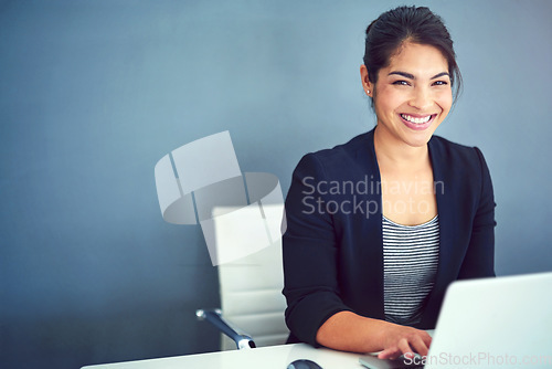 Image of Confidence, happy and portrait of a businesswoman working on a laptop by wall with mockup space. Happiness, smile and professional female human resources manager doing research in office with mock up