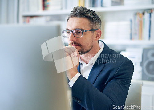 Image of Ceo, employee and man with focus, reading email and consultant in a workplace, research and search internet. Male person, entrepreneur or mature agent with a pc, concentration and website information