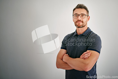 Image of Mockup, portrait and mature man with arms crossed, calm and casual outfit against a grey studio background. Face, male person and model with glasses, Canada and peace with confidence and happiness